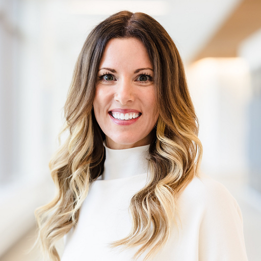 Target vice president of cybersecurity Jodie Kautt pictured in a white turtleneck sweater smiling with her hair down